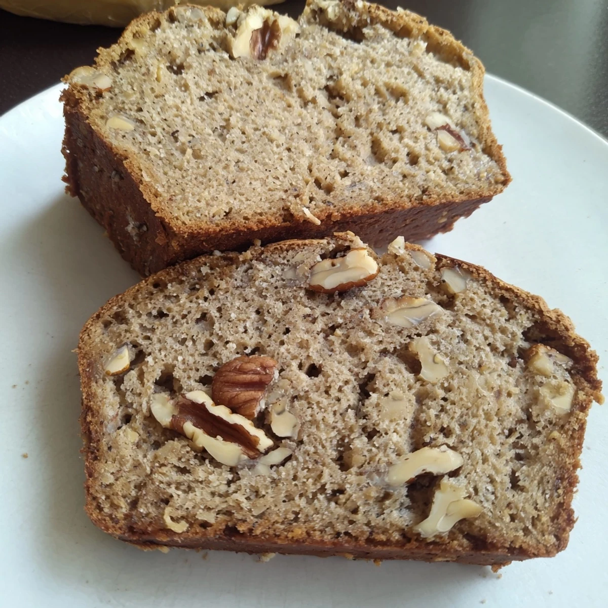 Golden-crusted Nutty Whole Wheat Loaf Bread, freshly baked, ready to be sliced and enjoyed.