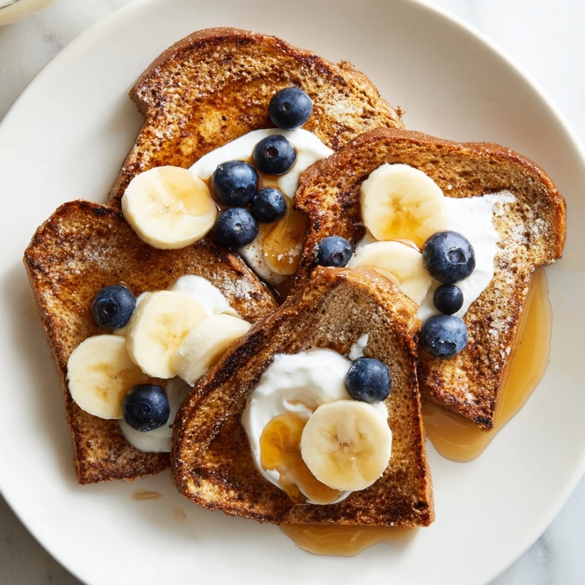 This photo shows beautifully browned Protein French Toast, ready to be enjoyed with a drizzle of maple syrup.