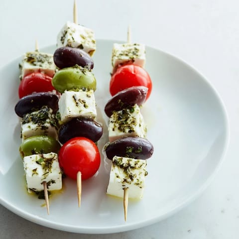Holiday Cheers Olive and Feta Skewers arranged on a platter, ready to be enjoyed as a vibrant appetizer.
