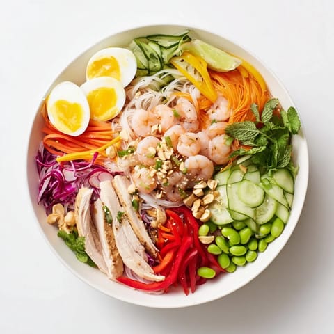 This Asian Fusion Noodle Bowl Board features a variety of dipping sauces surrounding fresh ingredients and tender noodles.