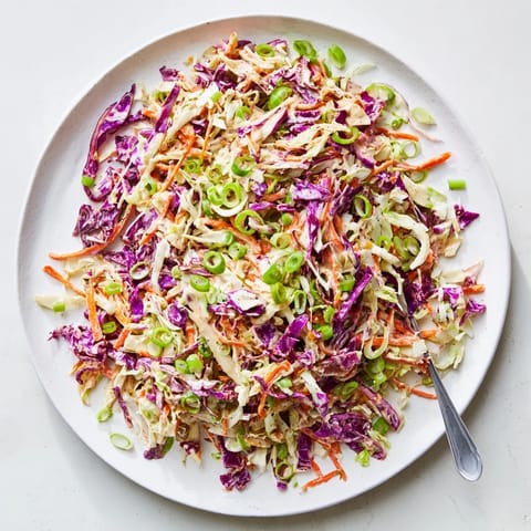 Fresh Best Cabbage Coleslaw made with green and red cabbage, grated carrots, and green onions for a colorful vibrant side dish.